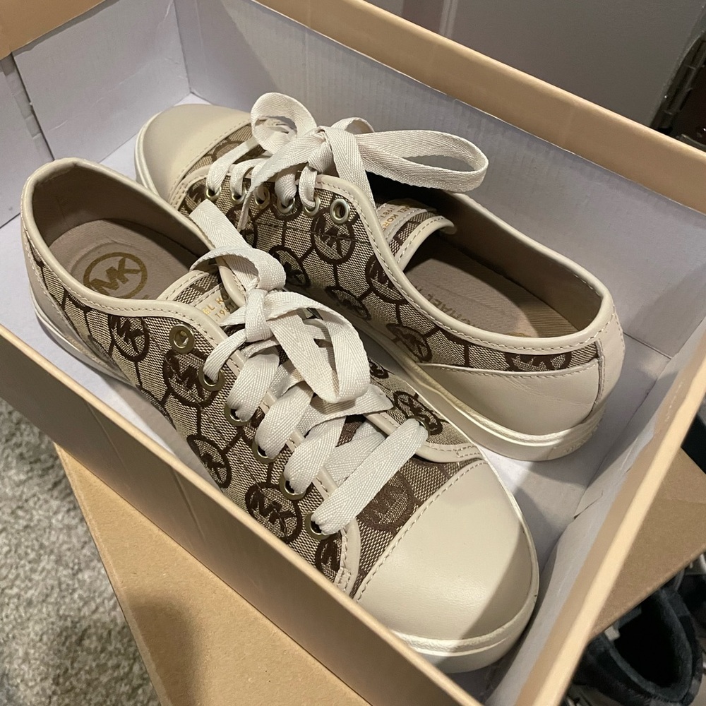 Never worn. New in box. Michael Kors sneakers. Size 6.5